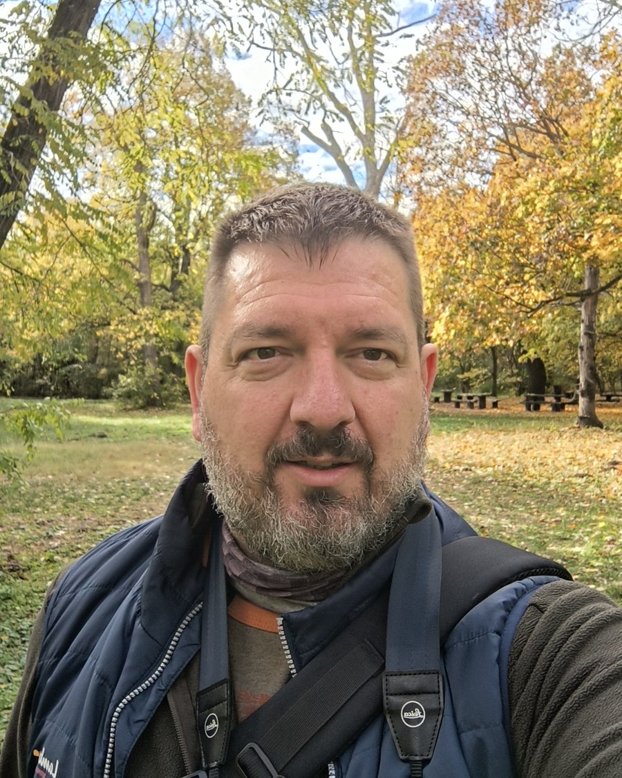 Zoltán Joó outdoors in a park in autumn